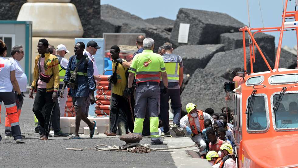 epa13149990 Migrants arrive at La Restinga dock on El Hierro, Spain, 04 August 2026. Spain's Maritime Rescue Service rescued 140 people from a small boat southwest of the island.  EPA/GELMERT FINOL