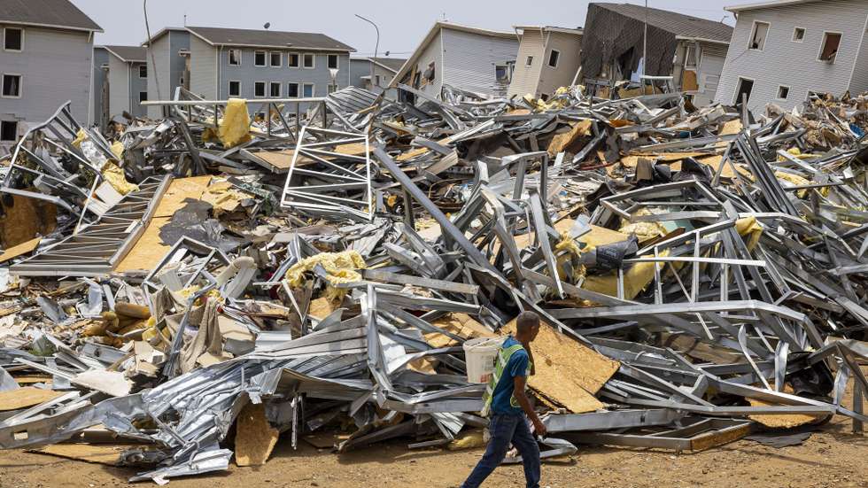 epaselect epa13180936 A man walks past the rubble of homes damaged by earthquakes in Catia La Mar, Venezuela, 17 August 2026 (issued 20 August 2026). Amid the ruins of buildings and the passage of machinery clearing away the rubble, nearly two months after the earthquakes of June 24, daily life has found its way back among hundreds of tents in the Venezuelan state of La Guaira, where precarious conditions and resilience prevail.  EPA/Miguel Gutierrez
