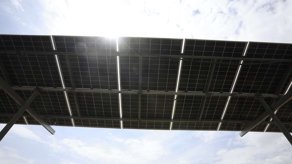 epa13117408 The Sun's light breaks through an array of solar power panels installed to power a water pump at a farm in Saawan village on the eastern outskirts of Sana'a, Yemen, 09 July 2026 (issued 17 July 2026). The installation of over two million solar panels in Yemen has provided power to 1.5 million households and farms after the country's electrical grid collapsed after more than a decade of war. What began as a response to the energy crisis has evolved into a rapidly growing renewable energy movement, restoring power to homes, businesses, hospitals, and schools. However, while essential services are being revitalized, environmental experts warn that the absence of effective regulatory water management could accelerate the depletion of Yemen's remaining water supplies.  EPA/YAHYA ARHAB