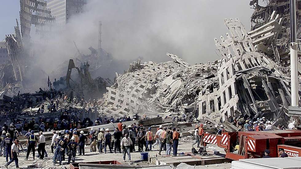 epa13210556 (FILE) - Fire and rescue workers search through the rubble of the World Trade Center in New York, USA, 13 September 2001 (reissued on 04 September 2026). On 11 September 2001, during a series of coordinated terror attacks using hijacked airplanes, two airplanes were flown into the World Trade Center's twin towers, causing the collapse of both towers. A third plane targeted the Pentagon, and a fourth plane heading towards Washington, DC ultimately crashed into a field. The 09/11 attacks were the deadliest terrorist attacks to occur on U.S. soil. In the days that followed, thousands of construction workers, firefighters, police officers, and volunteers flocked to the World Trade Center site to search for survivors and begin recovery efforts. Air travel came to a standstill, and people posted missing-person flyers all over the city as they moved through the dust and ash floating over Lower Manhattan  EPA/BETH A. KEISER / POOL / POOL *** Local Caption *** 57149225