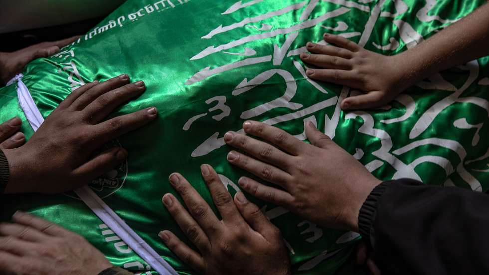 epaselect epa12963492 Palestinian relatives mourn over the body of Izz al-Din al-Haddad, the commander of the Al-Qassam Brigades, during his funeral procession in Gaza City, 16 May 2026. Hamas military wing's commander al-Haddad was killed alongside his wife and daughter in an Israeli airstrike in Gaza City on 15 May 2026. The strike resulted in the deaths of at least eight Palestinians and left dozens of others injured.  EPA/MOHAMMED SABER