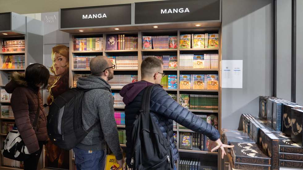 epa10431622 Visitors look at a manga books in one of the many comic festival locations during the 50th Angouleme International Comics Festival, in Angouleme, France, 26 January 2023. The festival is open to the public from January 26 to 29.  EPA/CAROLINE BLUMBERG