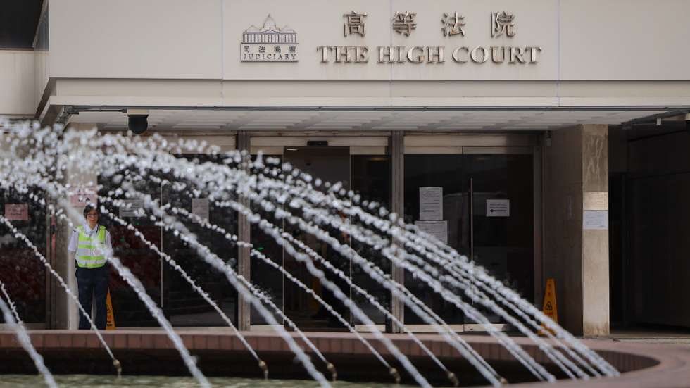 epa13253480 A security guard stands outside the High Court before the murder trial over the 2023 killing of Hong Kong model and socialite Abby Choi in Hong Kong, China, 21 September 2026. Choi’s former husband, Kwong Kong-chi (Alex Kwong), his father Kwong Kau and his brother Kwong Kong-kit (Anthony Kwong) are charged with murder and preventing the lawful burial of a body.  EPA/MAY JAMES