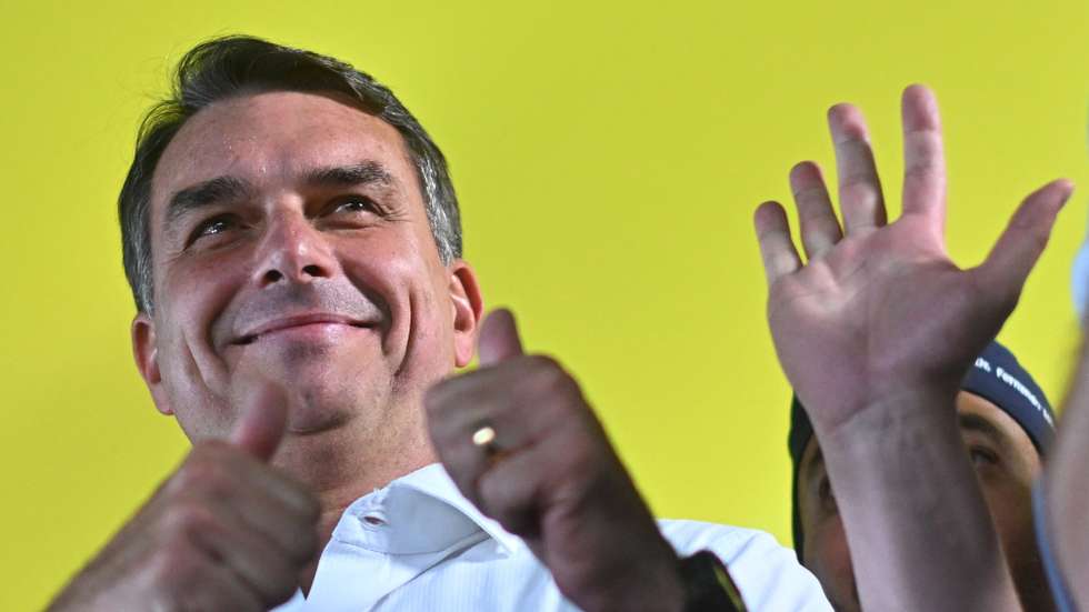 epa13285943 Brazilian presidential candidate Flavio Bolsonaro reacts during the announcement of support from former conservative Goias Governor Ronaldo Caiado for the second round of the Brazilian elections, in Goiania, Brazil, 06 October 2026. The former governor called for defeating Lula's PT (Workers' Party) in the presidential runoff, amid chants of 'minister, minister, minister' from his supporters urging him to join a potential cabinet led by the far-right senator.  EPA/Andre Borges