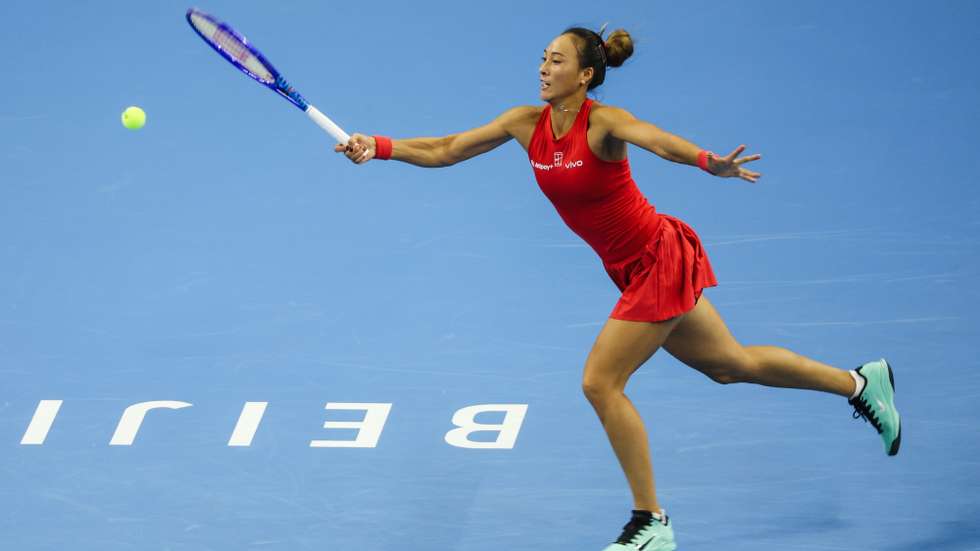 epa13294220 Zheng Qinwen of China in action against Elise Mertens of Belgium during their Women’s Singles semifinals match at the China Open tennis tournament in Beijing, China, 10 October 2026. China Open runs from 28 September through 11 October.  EPA/WU HAO