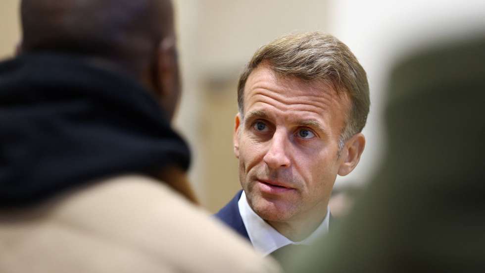 epa13325875 French President Emmanuel Macron (R) meets community members at the town hall in Trappes, near Paris, France, 23 October 2026. The visit follows a drive-by shooting that killed one person and wounded at least four others, including a 12-year-old girl.  EPA/HANNAH MCKAY / POOL MAXPPP OUT