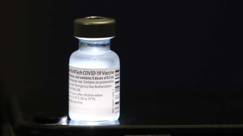 epa08895101 A detail view of a vial containing five doses of 0.3ml of the Pfizer-BioNTech COVID-19 vaccine at Shaare Zedek Medical Center in Jerusalem, Israel, 20 December 2020. Israel begins a nationwide COVID-19 vaccination campaign as hundreds of thousands of vaccines are delivered to hospitals across the country. First, the medical staff will be vaccinated and then people from high potential risk groups and the elderly population. Authorities hope to vaccinate as many people as possible.  EPA/ABIR SULTAN