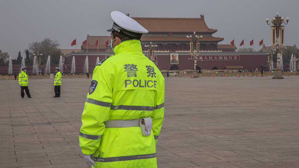 epa09067267 Police officers stand guard at Tiananmen Square prior to the closing session of the National People’s Congress (NPC) at the Great Hall of the People, in Beijing, China, 11 March 2021. China held two major annual political meetings, The National People’s Congress (NPC) and the Chinese People's Political Consultative Conference (CPPCC) which run alongside and together known as 'Lianghui' or 'Two Sessions'.  EPA/ROMAN PILIPEY