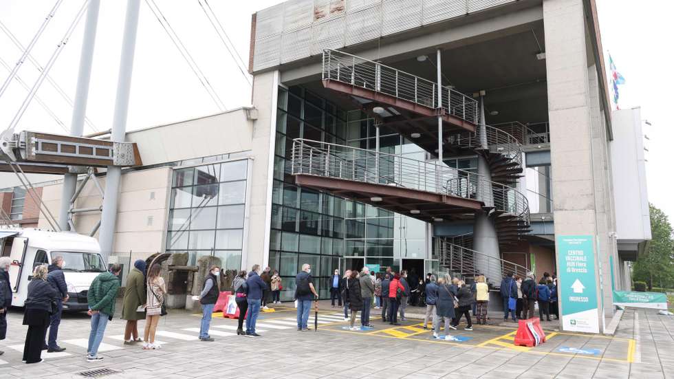 epa09167697 People wait to be vaccinated against Covid-19 disease at the vaccination hub set up at the Brescia Fair, in Brescia, northern Italy, 29 April 2021. . Italian health ministry said on 28 April there have been 13,385 new cases of COVID-19 in Italy in the last 24 hours, and death toll has now surpassed 120,000, while number of vaccine doses distributed in Italy has now passed the 20 million mark.  EPA/FILIPPO VENEZIA
