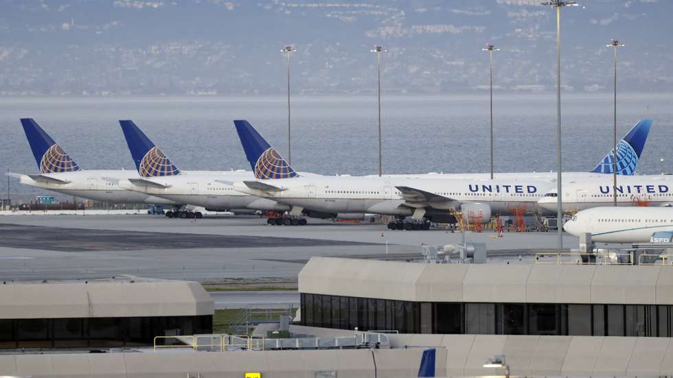 epa09030588 Several United Airlines Boeing 777-222 planes, including N773UA and N774UA, sit on the tarmac at the San Francisco International Airport (SFO) in San Francisco, California, USA, 22 February 2021. Federal regulators and United Airlines recently announced they will be grounding 24 Boeing 777 aircraft powered by Pratt &amp; Whitney 4000 series engines, the same engine used in the United Flight 328, tail number N772UA incident that experienced a right engine failure that scattered parts over a neighborhood in Colorado bound for Honolulu, Hawaii and made an emergency on its return to Denver International Airport.  EPA/JOHN G. MABANGLO