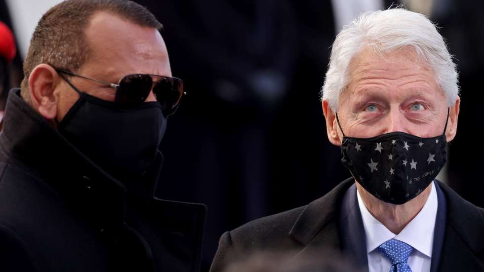 epa08952077 Former U.S. President Bill Clinton (R) and Former baseball player Alexander Rodriguez (L) are seen before the inauguration of Joe Biden as US President in Washington, DC, USA, 20 January 2021. Biden won the 03 November 2020 election to become the 46th President of the United States of America.  EPA/JONATHAN ERNST / POOL