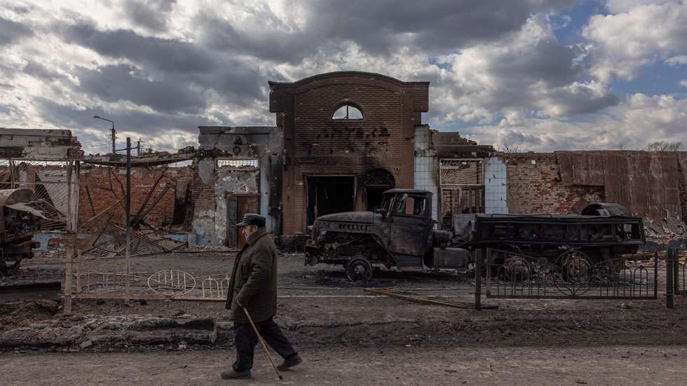 epa09859966 A man walks past destroyed Russian military vehicles next to the railway station where the Russian forces were stationed, in the recaptured by the Ukrainian army Trostyanets town, in Sumy region, Ukraine, 29 March 2022 (issued 30 March 2022). Trostyanets was recaptured by the Ukrainian army after the town was under Russian forces from the first days of war for over a month. Russian troops entered Ukraine on 24 February prompting the country's president to declare martial law and triggering a series of announcements by Western countries to impose severe economic sanctions on Russia.  EPA/ROMAN PILIPEY
