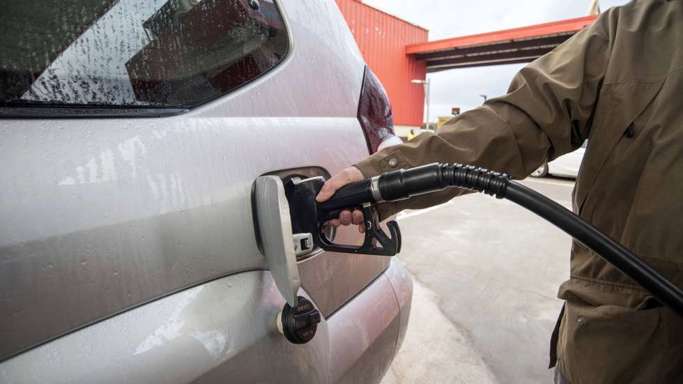 epa09863195 A man fills up his at a gas station in the town of Sant Luis, Menorca island, eastern Spain, 01 April 2022. The Spanish Government began on 01 April to subsidize the fuel price with a minimum reduction of 20 euro cents per liter of fuel to try to deal with the hike of prices amid the Russian invasion of Ukraine and after a strike called by hauliers. The measure will be in effect until next 30 June.  EPA/David Arquimbau Sintes