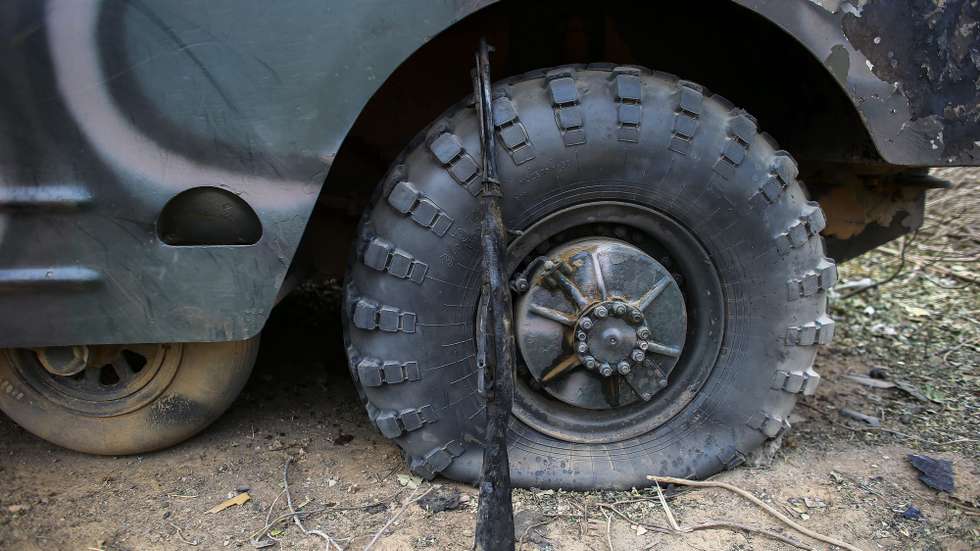 epa03566559 A photograph made available 03 February 2013 shows a burned rifle and a destoyed vehicle in a Mali military camp that was seized by Islamists and later destroyed by French airstrikes in Diabaly, Mali 25 January 2013. A report by Human Rights Watch released 01 February 2013 claims Malian government forces summarily executed at least 13 suspected Islamist supporters and forcibly disappeared five others from the garrison town of SÃ©varÃ© and in Konna during January 2013.  EPA/NIC BOTHMA