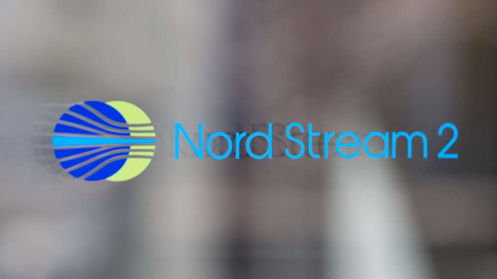epa09793327 A Nord Stream 2 logo is seen on a reflected glass front of the company's Switzerland headquarters in Zug, Switzerland, 01 March 2022. Zug-based Nord Stream 2, which is implementing the gas pipeline between Russia and Germany, has carried out a mass layoff because of the sanctions taken against Russia. 140 people have lost their jobs, said Swiss Federal Councillor Guy Parmelin.  EPA/PHILIPP SCHMIDLI