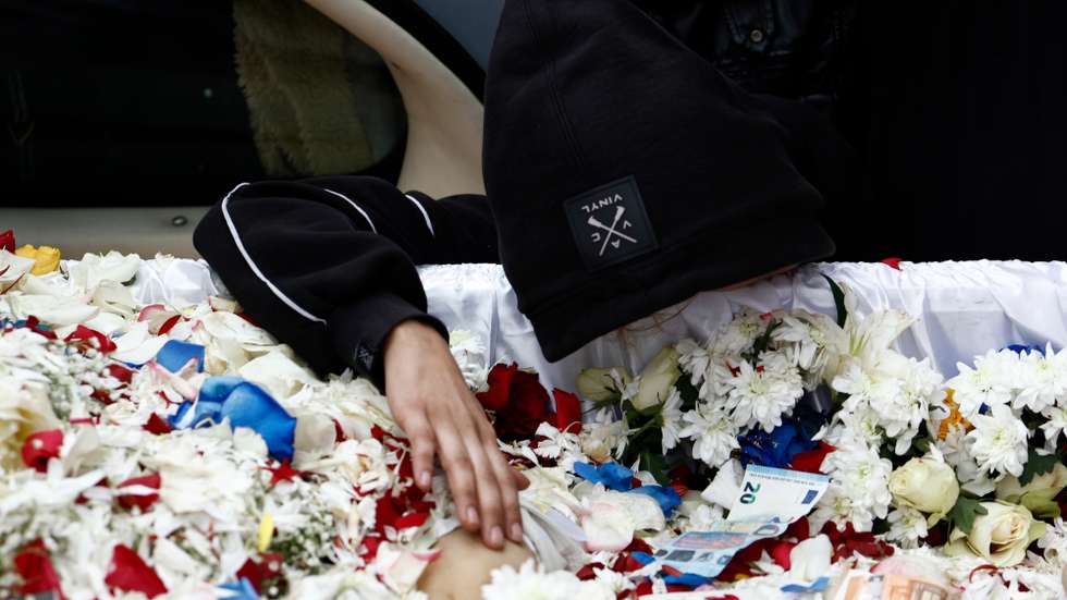epa10367088 Relatives and friends say goodbye to 16-year-old Kostas Fragoulis, in the Holy Church of Pammegisto Taxiarhon, Thessaloniki, Greece, 15 December 2022. The teenager's death was announced 13 December after being treated under critical condition in a hospital in Thessaloniki. Police claim they opened fire on the teenager to stop the vehicle he was driving from hitting officers on motorbikes as he tried to get away.  EPA/ACHILEAS CHIRAS