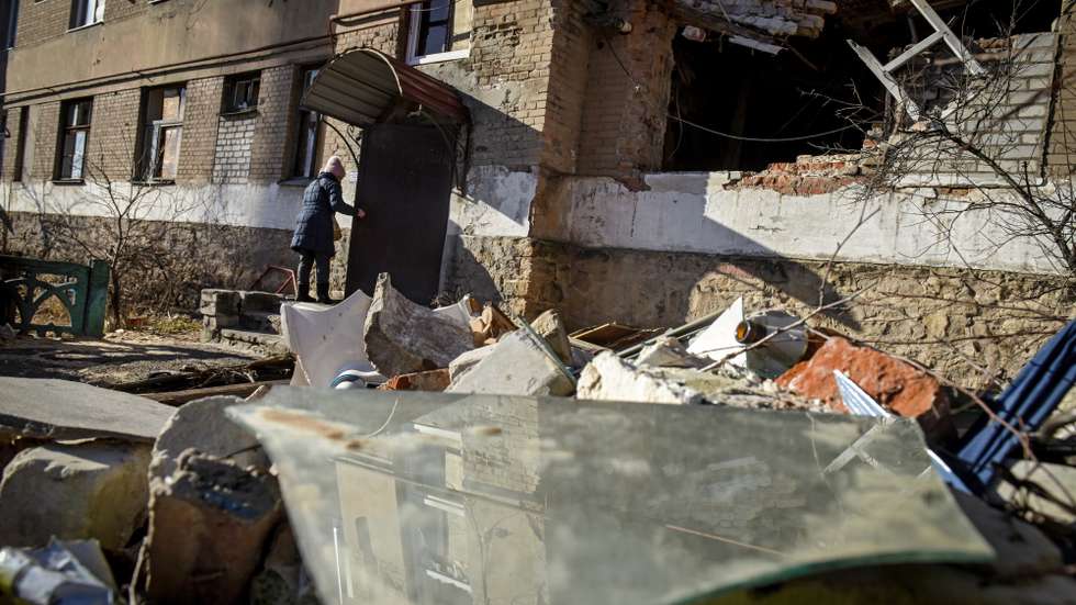 epa10431482 A woman enters her damaged apartment blocks  in retaken town Lyman Donetsk region, eastern Ukraine, 26 January 2023.
Lyman was re-captured by Ukraine armed forces in October.  Before the beginning of active combat action population of Lyman was around 41000. After being under Russian occupation, without electricity, water and gas supply, infrastructure is slowly renewing. Russian troops entered Ukraine on 24 February resulting in fighting and destruction in the country and triggering a series of severe economic sanctions on Russia by Western countries.  EPA/OLEG PETRASYUK