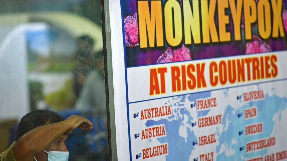 epa10334191 (FILE) - A security personnel looks on next to a list of high-risk countries for the Monkeypox virus, at Chennai International Airport, in Chennai, India, 16 July 2022 (reissued 28 November 2022). The World Health Organization (WHO) in a statement on 28 November 2022 said it "will begin using a new preferred term mpox as a synonym for monkeypox" simultaneously for one year until the term 'monkeypox' is phased out. The decsion was taken after consultations with global experts as "racist and stigmatizing language online, in other settings and in some communities was observed and reported to WHO."  EPA/IDREES MOHAMMED