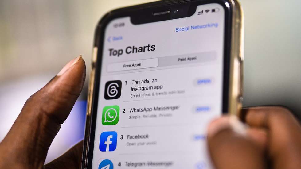 epa10732131 An employee downloads the newly unveiled Threads app on an iPhone at a design company in Chennai, India, 07 July 2023. Meta, the company behind Facebook and Instagram, said in a press release on 05 July 2023, that Mark Zuckerberg announced the initial version of 'Threads', an Instagram's text-based conversation app.  EPA/IDREES MOHAMMED