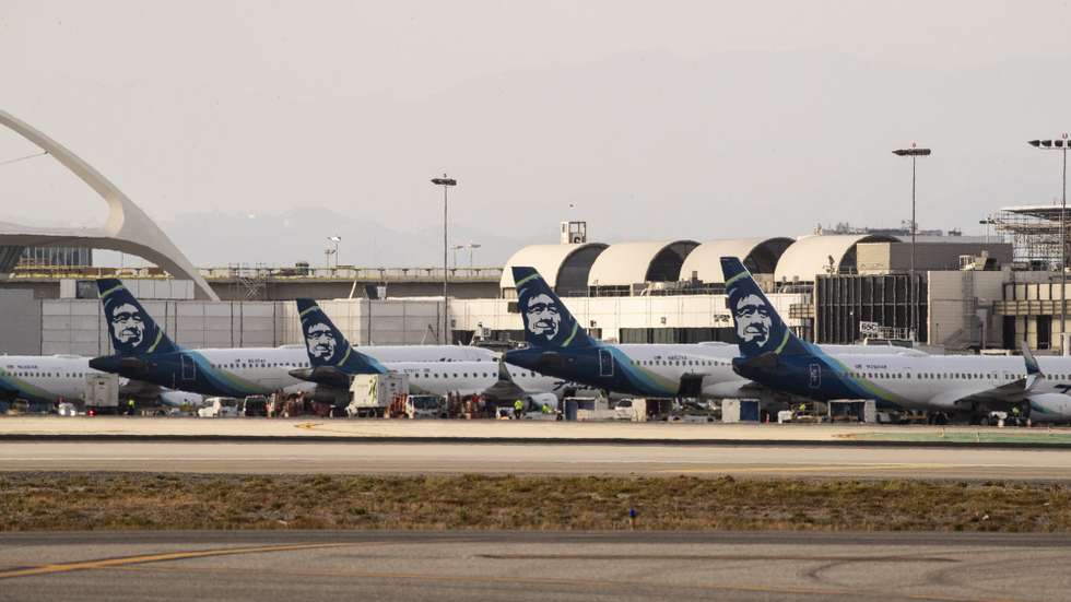 epa09999918 Alaska Airlines aircrafts are parked on the tarmac of the Los Angeles Airport in Los Angeles, California, USA, 06 June 2022.  EPA/ETIENNE LAURENT