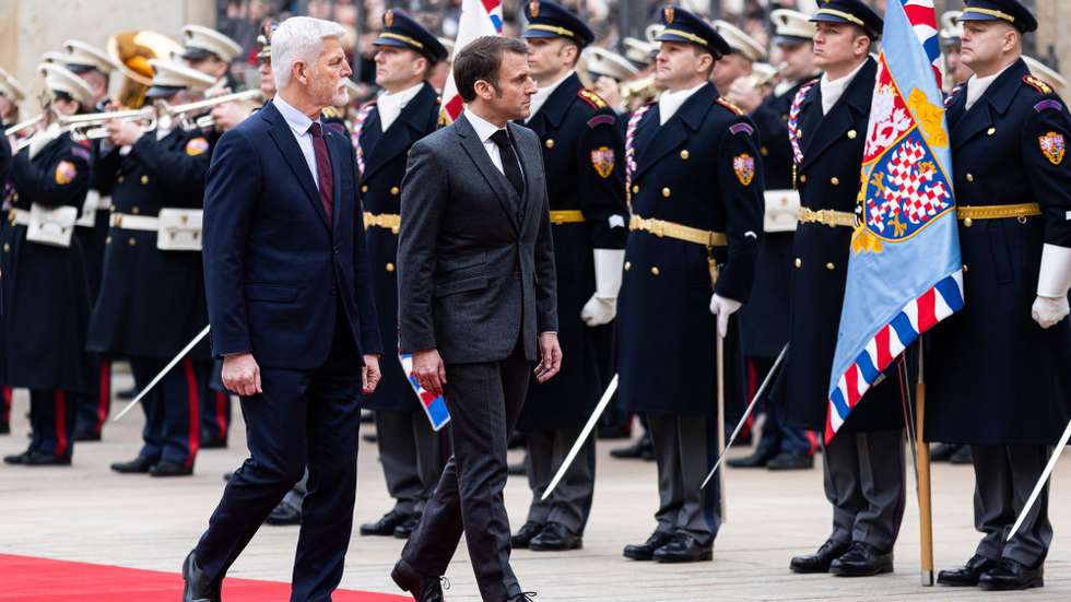 epa11199950 Czech President Petr Pavel (L) and French President Emmanuel Macron (R) inspect guards of honor during a welcome ceremony at Prague Castle in Prague, Czech Republic, 05 March 2024. Macron is on an offcial visit to Prague.  EPA/MICHAL TUREK