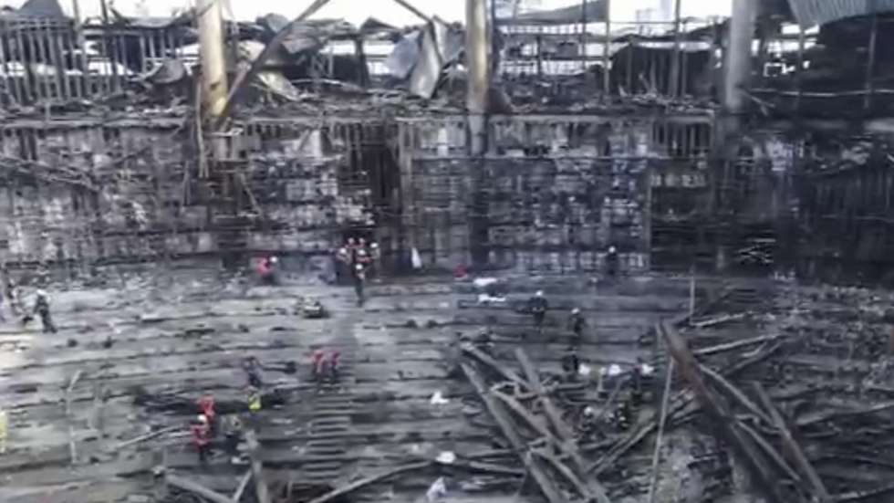 epa11244839 A handout still image taken from a handout video provided by the Russian Emergency Ministry shows rescues clearing debris in the hall of the burnt Crocus City Hall concert venue following a terrorist attack in Krasnogorsk, outside Moscow, Russia, 26 March 2024. At least 137 people were killed and more than 100 hospitalized after a group of gunmen attacked the concert hall in the Moscow region on 22 March evening, Russian officials said. Eleven suspects, including all four gunmen directly involved in the terrorist attack, have been detained, according to Russian authorities.  EPA/RUSSIAN EMERGENCIES MINISTRY HANDOUT   HANDOUT EDITORIAL USE ONLY/NO SALES HANDOUT EDITORIAL USE ONLY/NO SALES