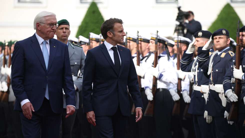 epa11371618 German President Frank-Walter Steinmeier (L) and French President Emmanuel Macron (3-L) walk next to each other during a reception with with military honors at Bellevue Palace in Berlin, Germany, 26 May 2024. Macron visits Germany from 26 to 28 May. The French President and Federal President Steinmeier will visit several regions of Germany together. It is the first state visit - the highest form of visit in diplomatic protocol - by a French president to Germany in 24 years.  EPA/CLEMENS BILAN