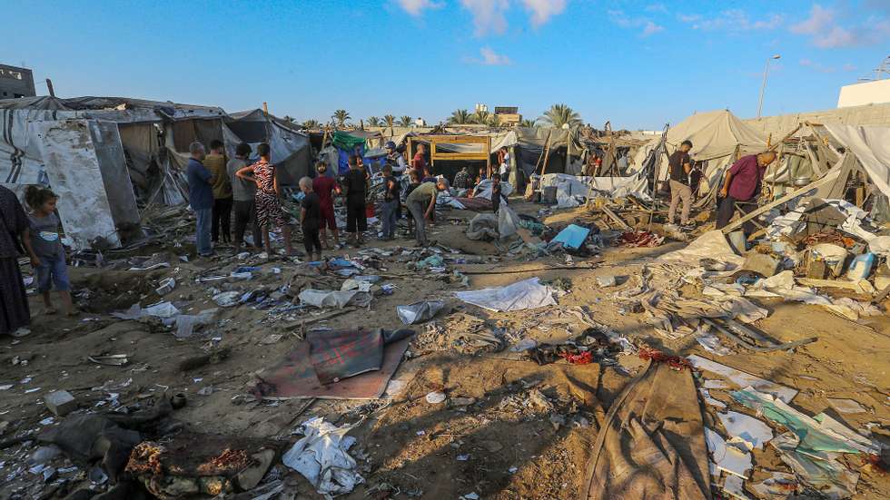 epa11586189 Internally displaced Palestinians inspect destroyed shelters following an Israeli military strike near Al-Aqsa Martyrs Hospital in Deir Al Balah, central Gaza Strip, 05 September 2024. According to the Palestinian Ministry of Health in Gaza, more than four Palestinians were killed after an Israeli air strike hit near the hospital. The Israeli military stated that it conducted a &#039;targeted&#039; airstrike overnight on a &#039;Command and Control Center&#039; used by Hamas and Islamic Jihad, which was embedded in the humanitarian area in Deir Al Balah, to &#039;remove an immediate threat&#039;, adding that prior to the strike &#039;numerous steps&#039; were taken to mitigate the risk of harming civilians. More than 40,000 Palestinians and over 1,400 Israelis have been killed, according to the Palestinian Health Ministry and the Israel Defense Forces (IDF), since Hamas militants launched an attack against Israel from the Gaza Strip on 07 October 2023, and the Israeli operations in Gaza and the West Bank which followed it.  EPA/MOHAMMED SABER