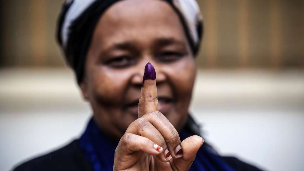 epa11650314 A woman shows her inked finger after casting her ballot for the Mozambique general elections at a polling station in Maputo, Mozambique, 09 October 2024. More than 17.1 million Mozambican voters will choose the President of the Republic, provincial assemblies and their governors, and 250 members of the Assembly of the Republic. The National Elections Commission (CNE) approved lists of 35 political parties running for the Assembly of the Republic and 14 political parties and groups of citizen voters for provincial assemblies.  EPA/JOSE COELHO