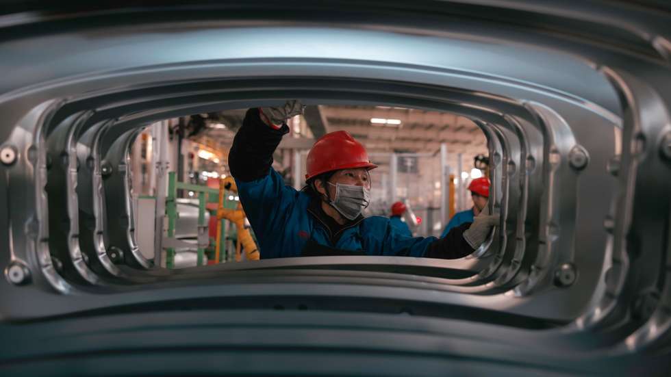 epa10974405 A person works in BYD electric cars factory in Changzhou, Jiangsu Province, China, 14 November 2023. According to published data, the output of BYD Changzhou base from January to July this year has exceeded 150,000 vehicles and the project has a planned annual production capacity of 400,000 vehicles.  EPA/ALEX PLAVEVSKI