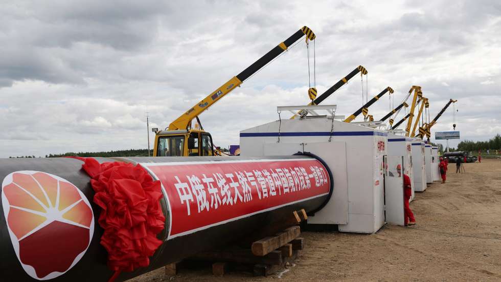 epa04824769 A picture made available on 30 June 2015 shows workers start the construction of the Chinese section of the China-Russia East Route natural gas pipeline, also known as the Power of Siberia trunk pipeline, in Heihe in northeast China's Heilongjiang province 29 June 2015. The 3,968-kilometer pipeline, running from Russian gas fields to Shanghai, will be completed in 2018 to be able to carry 38 billion cubic meters of natural gas to China every year.  EPA/SONG FULAI CHINA OUT
