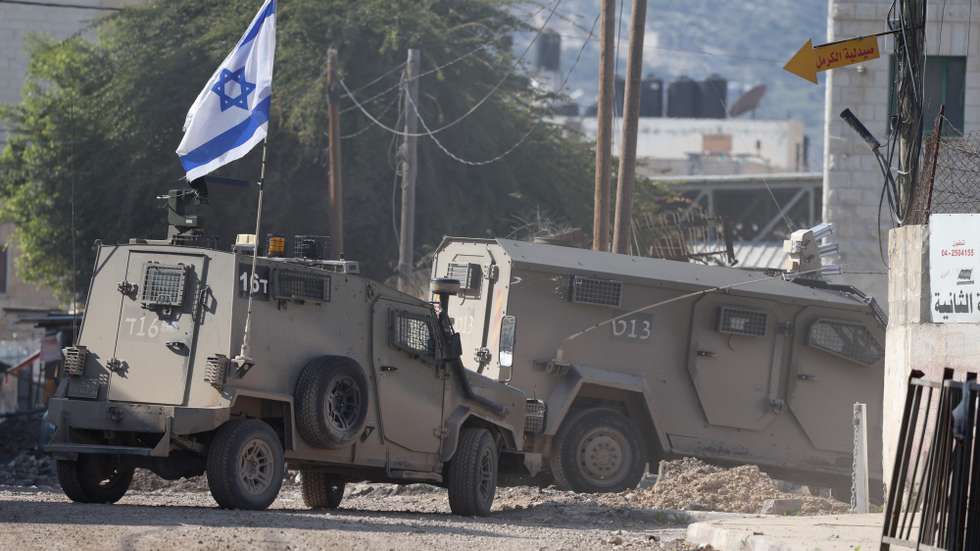 epa11860624 Israeli forces patrol the streets during the ninth day of an Israeli military operation in the West Bank city of Jenin, 29 January 2025. Two days after the ceasefire in the Gaza Strip between Israel and Hamas came into effect, the Israeli military on 21 January 2025 launched an operation in Jenin resulting in at least 17 Palestinian deaths and more than 60 injuries, according to the Palestinian Ministry of Health.  EPA/ALAA BADARNEH