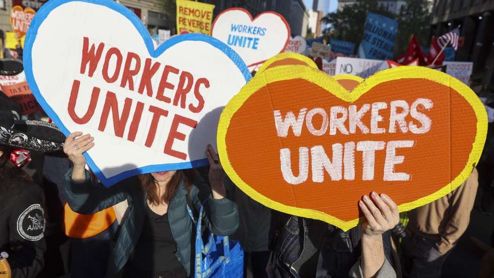 epa12068602 People march in a May Day rally in New York, New York, USA, 01 May 2025. International Workers' Day, also known as Labor Day or May Day, is observed worldwide on 01 May to celebrate the economic and social achievements of workers as well as fight for laborers' rights.  EPA/SARAH YENESEL