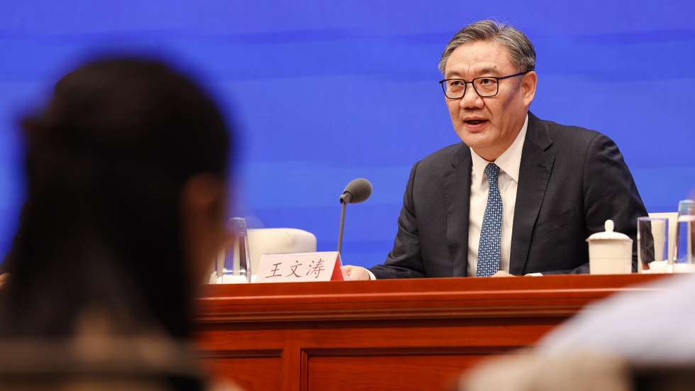 epa12244210 China's Minister of Commerce Wang Wentao speaks during a press conference on 'achievements in high-quality commerce development during the 14th Five-Year Plan Period' in Beijing, China, 18 July 2025.  EPA/WU HAO