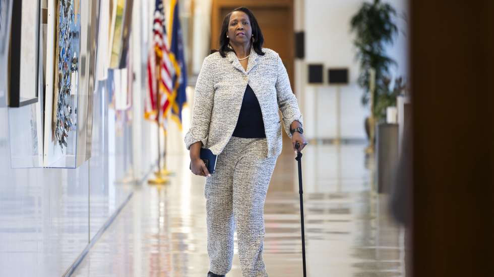epa11236718 Federal Reserve Board Governor Lisa Cook prepares to attend a listening session about the post-pandemic economy at the Federal Reserve in Washington, DC, USA, 22 March 2024. The Fed left interest rates unchanged on 20 March, but signaled they plan three rate cuts later in 2024.  EPA/JIM LO SCALZO