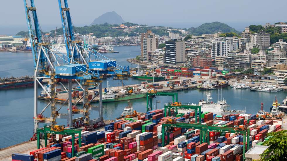 epa12287715 Shipping containers are being moved at the port in Keelung City, Taiwan, 07 August 2025. On 06 August, U.S. President Donald Trump announced that the United States intends to impose a tariff of approximately 100 percent on imported semiconductor chips, with exemptions for companies that are building or have committed to building manufacturing facilities in the United States. Taiwan, as the home of the world-leading chipmaker Taiwan Semiconductor Manufacturing Co. (TSMC), is a significant player in the global supply chain for semiconductors, which are essential for products ranging from smartphones and cars to military equipment.  EPA/RITCHIE B. TONGO