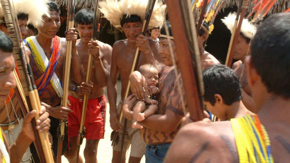 Waimiri-atroari indigenous tribe members gather around the thousandth member of the tribe, Tuesday 09 December 2003 overcoming the risk of extinction that threatened them in the past.  EPA/Euzivaldo Queiroz