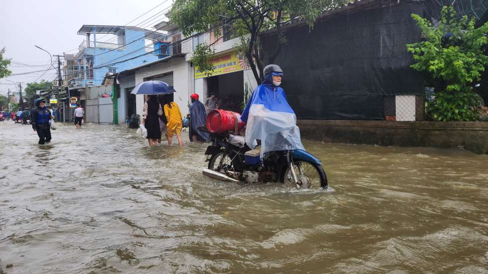 epa12178370 A handout photo made available by the Vietnam News Agency shows people walking through flood waters in Hue City, central Vietnam, 13 June 2025 (issued 16 June 2025). Six dead, and another remains missing in central Vietnam due to flooding triggered by Typhoon Wutip, according to the Vietnam Disaster and Dyke Management Authority.  EPA/VIETNAM NEWS AGENCY / HANDOUT VIETNAM OUTHANDOUT EDITORIAL USE ONLY/NO SALES