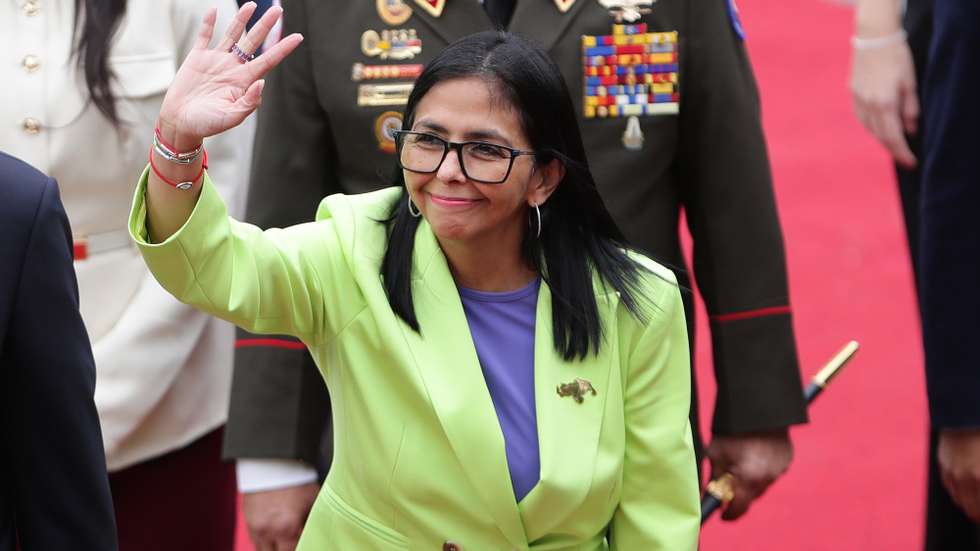 epa12652216 The acting president of Venezuela, Delcy Rodriguez, waves before presenting a report to Parliament in Caracas, Venezuela, 15 January 2026. Rodriguez delivered the report as Venezuelan President Nicolas Maduro is currently detained in the United States along with his wife, Cilia Flores, after they were captured during a US military operation on 03 January 2026.  EPA/RONALD PENA R