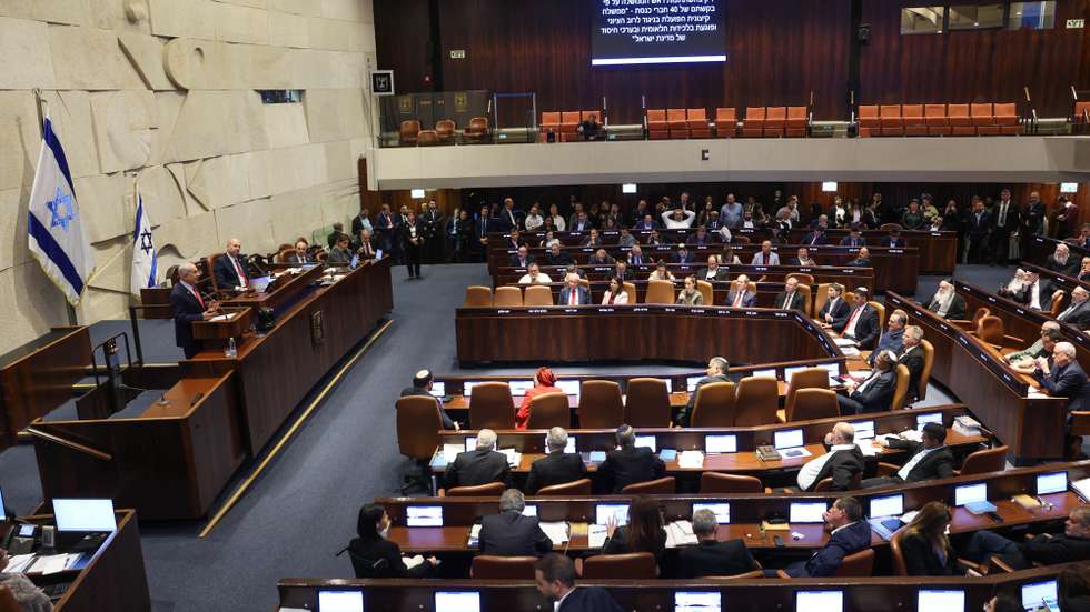 epa12629261 Israeli Prime Minister Benjamin Netanyahu (L) speaks during a debate initiated by the opposition as part of a plenary session in the Knesset, the Israeli parliament, in Jerusalem, 05 January 2026. The title of the debate submitted by the opposition is 'An extremist government that acts contrary to the Zionist majority and harms national cohesion and the fundamental values of the State of Israel'.  EPA/ABIR SULTAN EPA