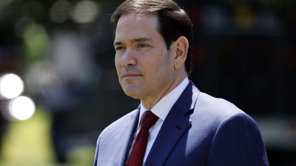 epa12951304 US Secretary of State Marco Rubio watches as US President Donald Trump talks to the media before leaving the South Lawn of the White House, Washington, DC, USA, 12 May 2026. President Trump is leaving the US to visit China where he will meet with President Xi in Beijing.  EPA/WILL OLIVER