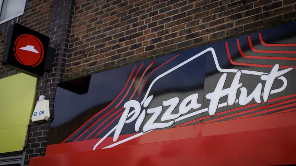 epa12470202 A Pizza Hut restaurant on Walthamstow Market in east London, Britain, 21 October 2025. Pizza Hut will shut 68 of its restaurants and 11 delivery outlets in the UK. The pizza chain is expected to make 1,210 people redundant as part of a restructuring by the US company Yum! Brands.  EPA/TOLGA AKMEN