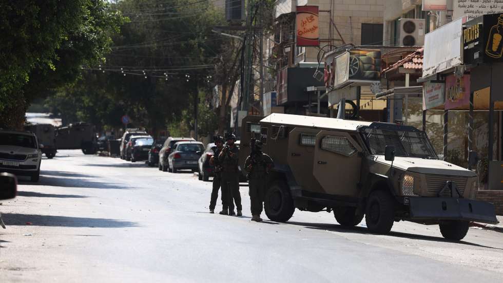 epa13130846 Israeli army forces conduct a raid at Nablus Hospital to arrest wounded Palestinian men, in the West Bank city of Nablus, 24 July 2026. According to the Palestinian Ministry of Health, at least four Palestinians were killed and up to four wounded during clashes with Israeli settlers in Nablus on 24 July. The Israeli Military was deployed and has reported at least three Israeli civilian casualties and one fatality.  EPA/ALAA BADARNEH