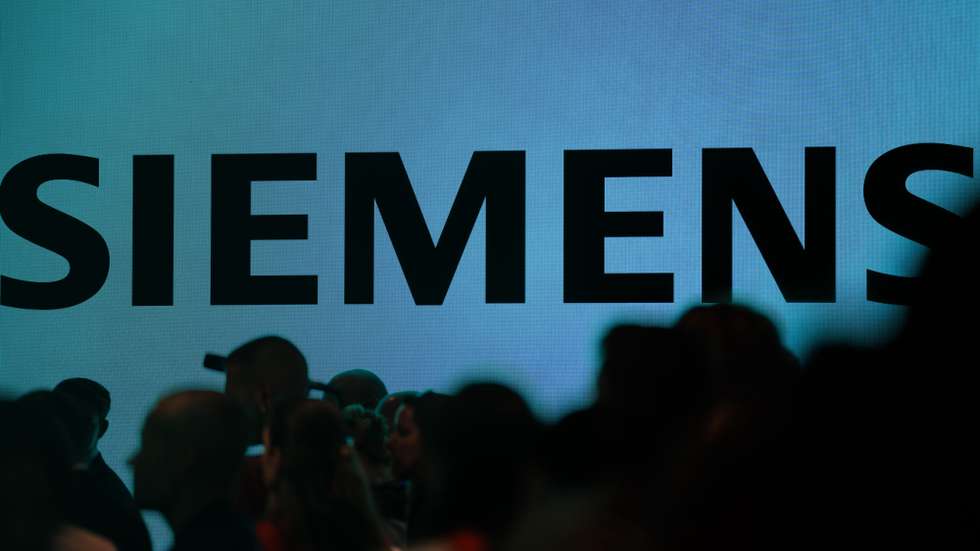 epa12354228 The Siemens logo is seen on a display during the opening day of the IFA trade fair in Berlin, Germany, 05 September 2025. The IFA, the world's largest trade show for consumer electronics and home appliances runs from 05 to 09 September 2025.  EPA/CLEMENS BILAN