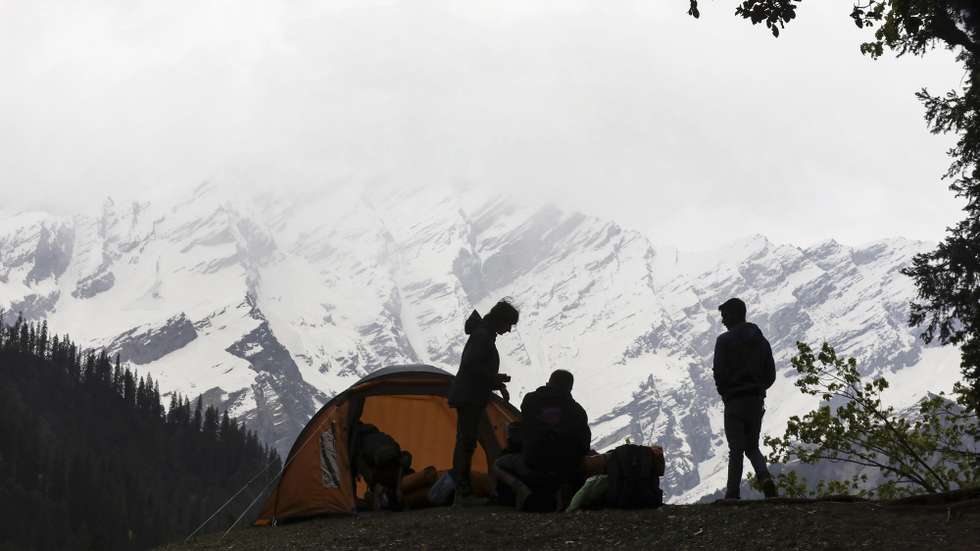 epa10647917 Crew members stand beside a tent as they prepare the set during the shooting of the movie 'Valle de Sombras', in Solang Valley, in the northern Indian state of Himachal Pradesh, India, 17 May 2023 (Issued 23 May 2023). Spanish film director Salvador Calvo is currently in the Himalayas shooting 'Valle de sombras', a film starring Miguel Herran, that embarks on an adventure reflecting on guilt in an area full of dangers in the north of India. The production of 'Valle de Sombras' (Valley of Shadows) began in 2020, in the midst of a pandemic, when Calvo traveled to northern India with a small production group to assess the possible scenarios for this ambitious film.  EPA/RAJAT GUPTA