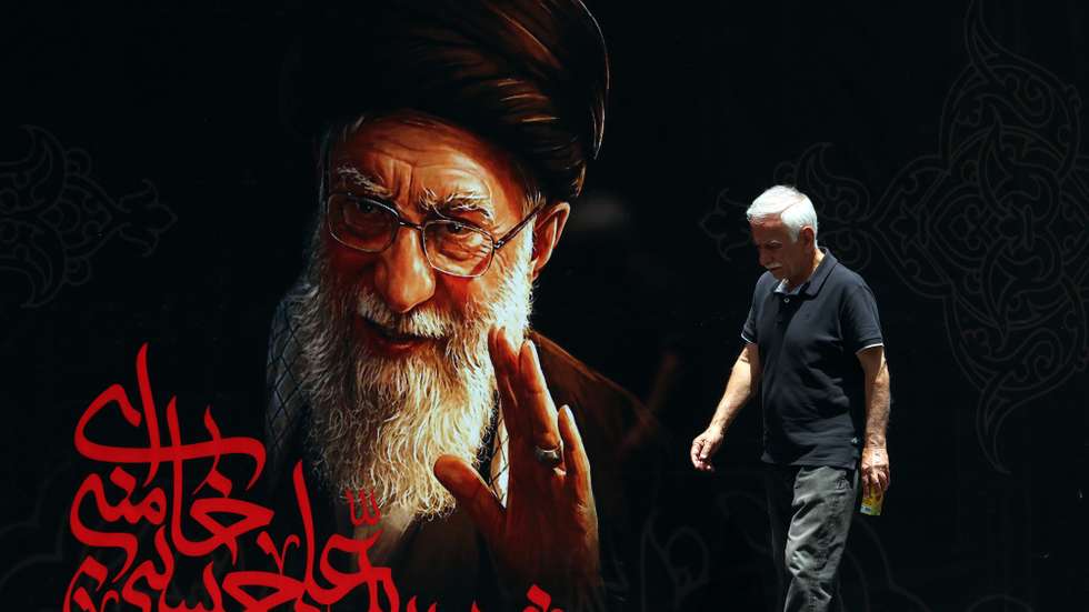 epa13082608 An Iranian man walks in front of a billboard of late Iranian Supreme Leader Ayatollah Ali Khamenei ahead of his funeral ceremonies in Tehran, Iran, 03 July 2026. Iran is set to hold a multi-day state funeral from 04 to 09 July for Khamenei, who was killed in a joint US and Israeli airstrike on 28 February.  EPA/ABEDIN TAHERKENAREH RESTRICTIONS: NO Access Israel Media/Persian Language TV Stations Outside Iran/Strictly No Access BBC Persian/VOA Persian/Manoto TV/Iran International TV. (As mandated by Iran's Directorate General for Foreign Media) --