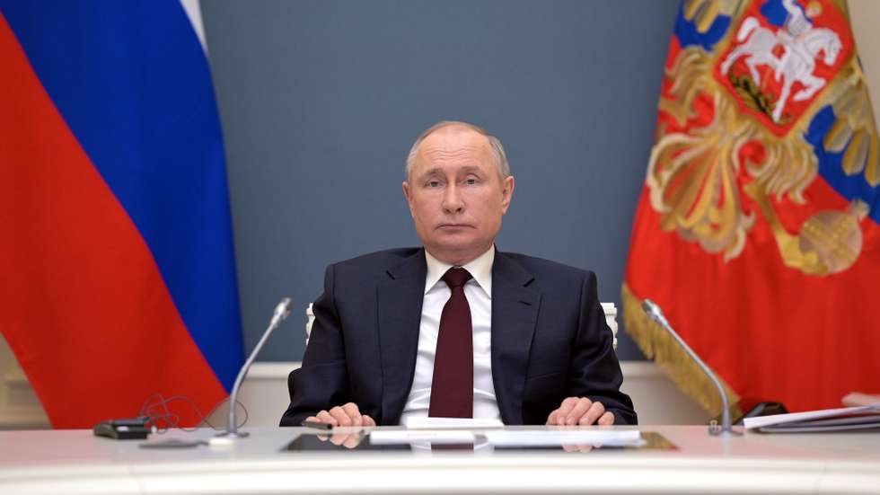 epa09152687 Russian President Vladimir Putin attends a virtual Leaders Summit on Climate from Moscow, Russia, 22 April 2021. The meeting is intended to underline the urgency and economic benefits of stronger climate action on the road to the United Nations Climate Change Conference (COP26) in Glasgow in November 2021. Around 40 international leaders attend the summit.  EPA/ALEXEI DRUZHININ / SPUTNIK / KREMLIN POOL