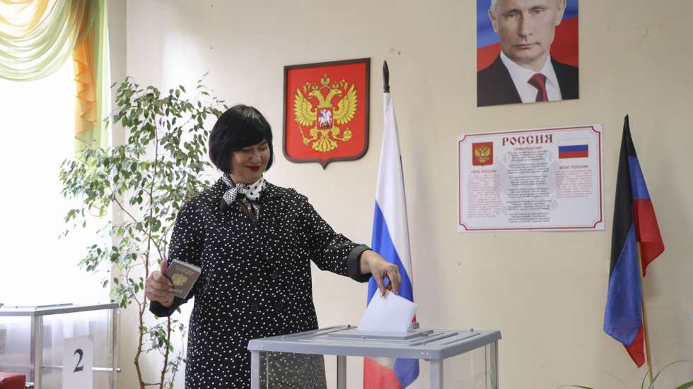 epa10850132 A woman casts her ballot at a polling station during the local elections in Donetsk, Russian-controlled Ukraine, 09 September 2023. Ukraine's Ministry of Foreign Affairs on 08 September released a statement saying that the 'so-called elections in the temporarily occupied territories are null and void'. Elections of various levels are held in Russia from 08 to 10 September 2023. The Central Election Commission of Russia has extended the elections in Ukraine's self-proclaimed Donetsk People's Republic, Luhansk, Zaporizhzhia and Kherson regions.  EPA/STRINGER