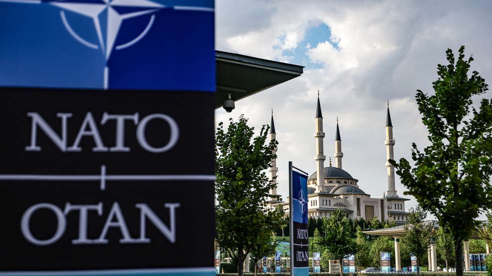 epa13092354 NATO banners near the Millet Mosque ahead of the NATO Summit 2026 in Ankara, Turkey, 06 July 2026. The summit will take place on 07–08 July, focusing on strengthening defense industrial production and securing long-term military aid for Ukraine.  EPA/FILIP SINGER