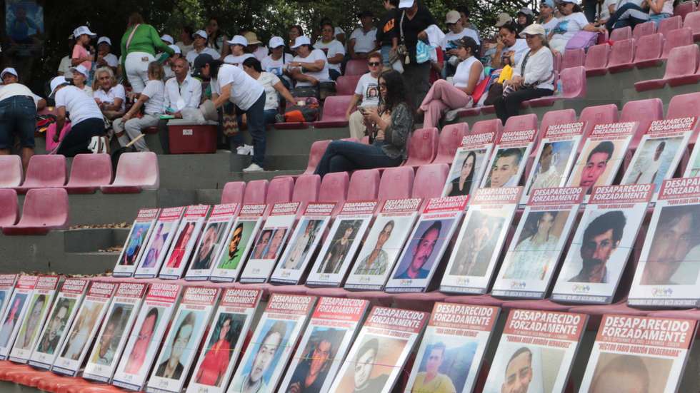 epa13200941 Photographs of missing persons are displayed on the boardwalk to mark the International Day of the Victims of Enforced Disappearances in Cucuta, Colombia 30 August 2026. The International Day of the Victims of Enforced Disappearances is observed annually on 30 August to raise awareness of enforced disappearances and honour victims and their families.  EPA/MARIO CAICEDO